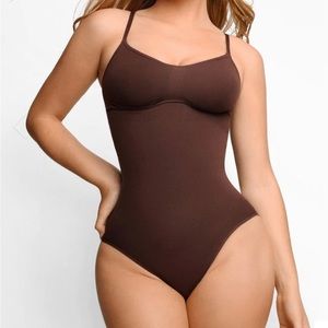 Unworn small body suit/shapewear